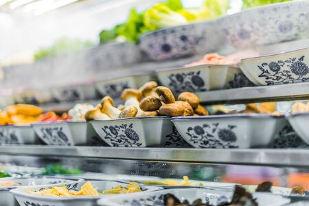 Traditional Asian food ingredients and dishes sold in a singapore restaurantの写真素材