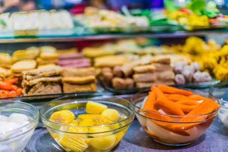 Traditional Asian food ingredients and dishes sold in a singapore restaurantの写真素材