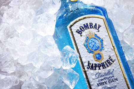 POZNAN, POL - MAY 28, 2020: Bottle of Bombay Sapphire, a brand of gin distributed by Bacardi. Introduced to the market in 1987 by International Distillers and Vintners.のeditorial素材