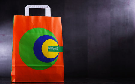 POZNAN, POL - NOV 28, 2019: Paper shopping bag of Benetton, a global fashion brand based in Ponzano Veneto, Italy founded in 1965のeditorial素材