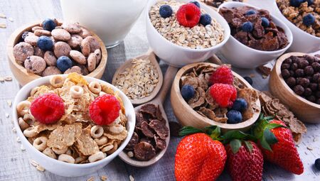Bowls containing different sorts of breakfast cereal products.の写真素材