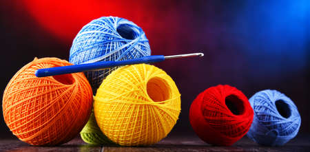 Composition with assortment of different colored yarns and hook for crochetingの写真素材