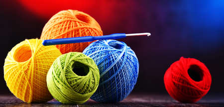 Composition with assortment of different colored yarns and hook for crochetingの写真素材