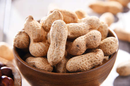 Composition with bowl of peanutsの写真素材