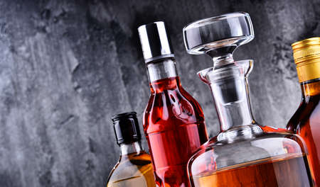 Composition with carafe and bottles of assorted alcoholic beverages.の写真素材