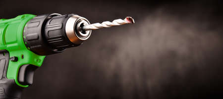 Cordless drill with drill bit working also as screw gun.の写真素材