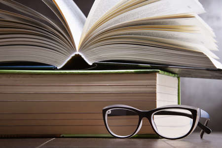 Composition with open book on the table.の写真素材