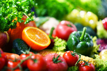 Composition with variety of fresh organic vegetables and fruitsの写真素材