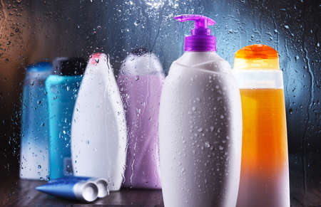 Different containers of body care products in the bathroom.の写真素材