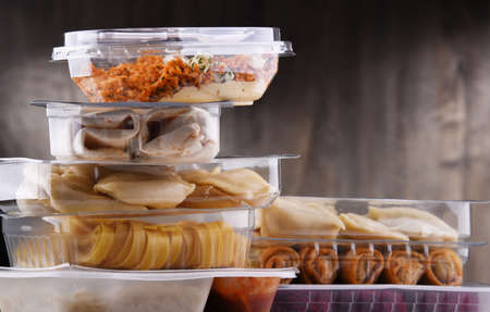 A variety of prepackaged food products in plastic boxes.の写真素材