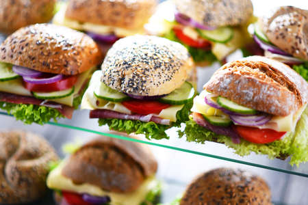 Ham and cheese sandwiches displayed for sale.