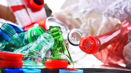 Recyclable garbage consisting of glass, plastic, metal and paper.