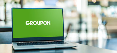 POZNAN, POL - JAN 6, 2021: Laptop computer displaying logo of Groupon, a global e-commerce marketplace connecting subscribers with local merchantsのeditorial素材