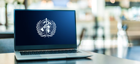 POZNAN, POL - NOV 12, 2020: Laptop computer displaying logo of The World Health Organization (WHO), a specialized agency of the United Nations responsible for international public healthのeditorial素材