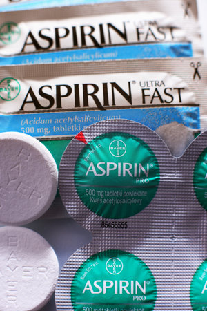 POZNAN, POL - FEB 17, 2021: Aspirin pills, a brand of popular medication, the first and best-known product of Bayer, German multinational pharmaceutical company headquartered in Leverkusenのeditorial素材