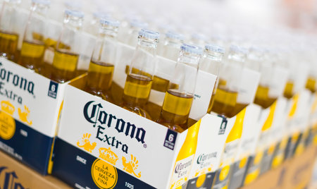 POZNAN, POL - APR 13, 2021: Six-packs of Corona beer put up for sale in a supermarketのeditorial素材