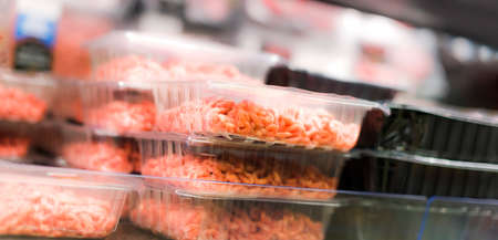 Meat products put up for sale in a supermarket commercial refrigerator
