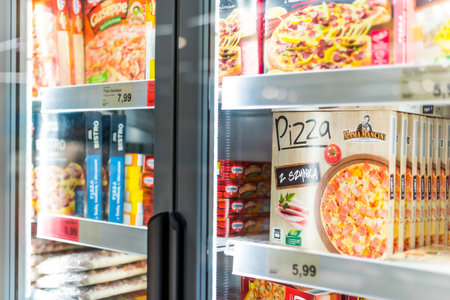 POZNAN, POL - APR 13, 2021: Food products put up for sale in a commercial refrigeratorのeditorial素材