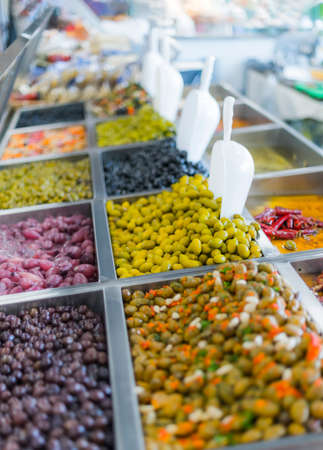 Fresh olives put up for sale in a supermarket.の写真素材
