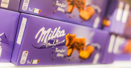 POZNAN, POL - APR 28, 2021: Milka chocolate bars put up for sale in a discount storeのeditorial素材