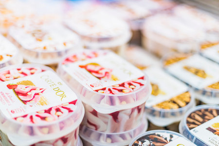 POZNAN, POL - APR 28, 2021: Algida ice cream products put up for sale in a commercial refrigeratorのeditorial素材