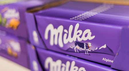 POZNAN, POL - APR 28, 2021: Milka chocolate bars put up for sale in a discount store