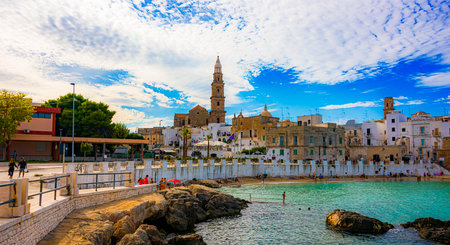 MONOPOLI, ITALY - SEP 2, 2020: View of Monopoli from the city beach of Cala Porta Vecchia, Apulia, Italy, located on the Adriatic Seaのeditorial素材