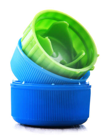 Colorful plastic bottle caps isolated on white. Recycling