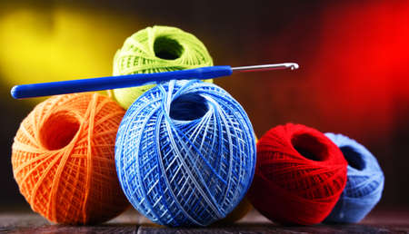 Composition with assortment of different colored yarns and hook for crochetingの写真素材
