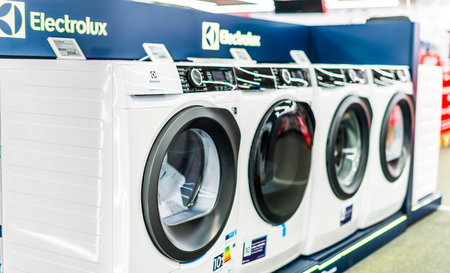 POZNAN, POL - AUG 18, 2021: Front-loader washing machines by Electrolux put up for sale in a household goods storeのeditorial素材