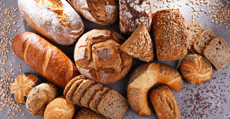 Assorted bakery products including loafs of bread and rollsの写真素材