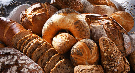 Assorted bakery products including loafs of bread and rollsの写真素材