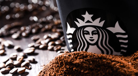 POZNAN, POL - AUG 19, 2021: Cup of Starbucks, the name of coffee company and coffeehouse chain, founded in Seattle, Wa. USA, in 1971; now the largest business of this kind in the world.のeditorial素材