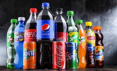 POZNAN, POLAND - OCT 28, 2021: Bottles of global soft drink brands including products of Coca Cola Company and Pepsicoのeditorial素材