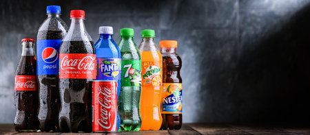 POZNAN, POLAND - OCT 28, 2021: Bottles of global soft drink brands including products of Coca Cola Company and Pepsicoのeditorial素材