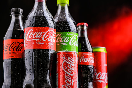 POZNAN, POL - OCT 28, 2021: Bottles and cans of Coca-Cola, a carbonated soft drink manufactured by The Coca-Cola Company headquartered in Atlanta, Georgia, USAのeditorial素材