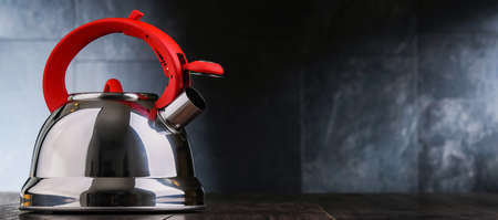A stainless steel stovetop kettle with whistleの写真素材