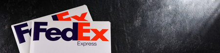 POZNAN, POL - DEC 26, 2021: Envelopes of FedEx, an American multinational courier delivery services...