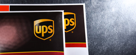 POZNAN, POL - DEC 26, 2021: Envelopes of United Parcel Service or UPS, the world's largest package delivery company, shipping over 15 million packages per day in more than 220 countriesのeditorial素材
