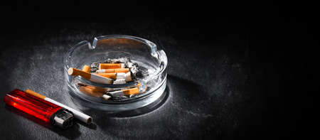 Composition with an ashtray and cigarettes.の写真素材