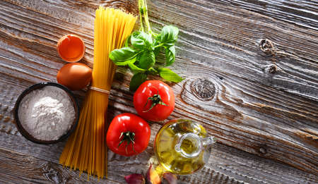 Composition with dried spaghetti, and pasta ingredients.の写真素材