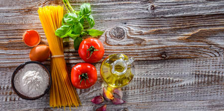 Composition with dried spaghetti, and pasta ingredients.の写真素材