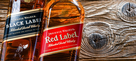 POZNAN, POL - APR 7, 2022: Bottles of Johnnie Walker, the most widely distributed brand of blended Scotch whiskey in the world with sales of over 130 million bottles a year.のeditorial素材
