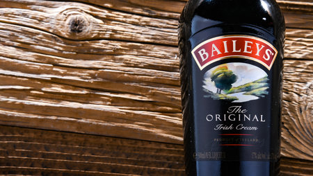 POZNAN, POL - APR 13, 2022: Bottle of Baileys Irish Cream, an Irish whiskey- and cream-based liqueur, made by Gilbeys of Ireland. Brand currently owned by Diageo.のeditorial素材