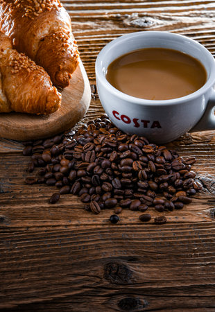 POZNAN, POL - APR 14, 2022: Cup of Costa Coffee, a brand of British multinational coffeehouse company headquartered in Dunstable, Bedfordshire; second largest coffeehouse chain in the worldのeditorial素材