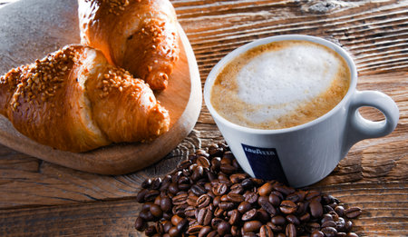 POZNAN, POL - APR 14, 2022: Cup of Lavazza coffee, a brand owned by an Italian manufacturer of coffee products, founded in Turin in 1895 by Luigi Lavazzaのeditorial素材