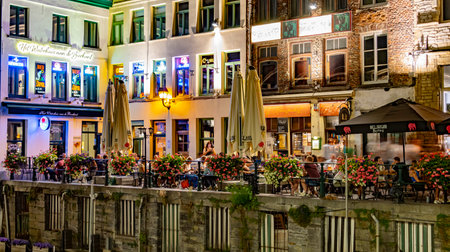 GHENT BELGIUM - AUG 24, 2022: Restaurants in the old town of Ghent, in the Flemish Region of Belgium, in the nightのeditorial素材