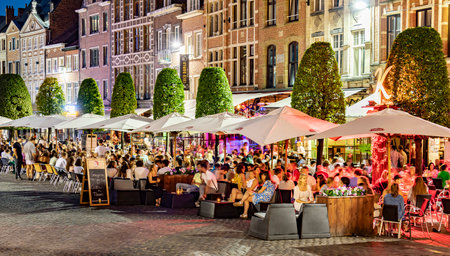 LEUVEN, BELGIUM - AUG 25, 2022: Restaurants in the old town of Leuven, in the Flemish Region of Belgium, in the nightのeditorial素材