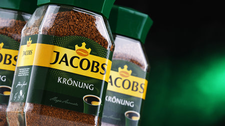 POZNAN, POLAND - JUL 14, 2022: Containers of Jacobs instant coffee, a brand of coffee marketed in Europe by Jacobs Douwe Egbertsのeditorial素材