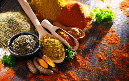 Composition with spices on wooden kitchen table.の写真素材